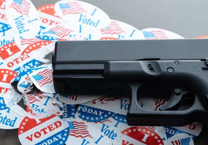 Concept,For,Election,Violence,With,Handgun,Placed,On,Many,Torn
