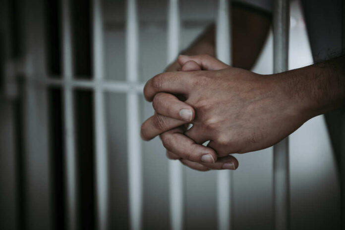 Hands,Of,Men,Desperate,To,Catch,The,Iron,Prison,prisoner,Concept,thailand