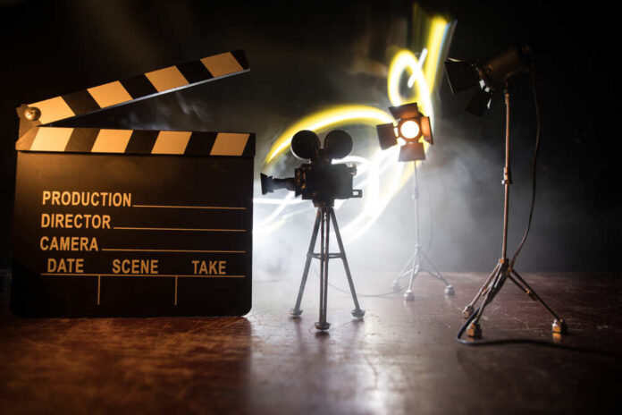 Movie,Concept.,Miniature,Movie,Set,On,Dark,Toned,Background,With
