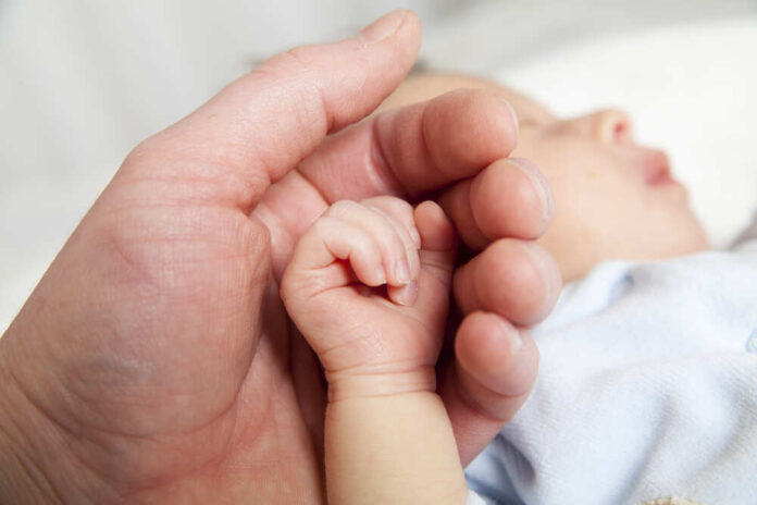 Hold,A,Hand,Of,The,Newborn,Child