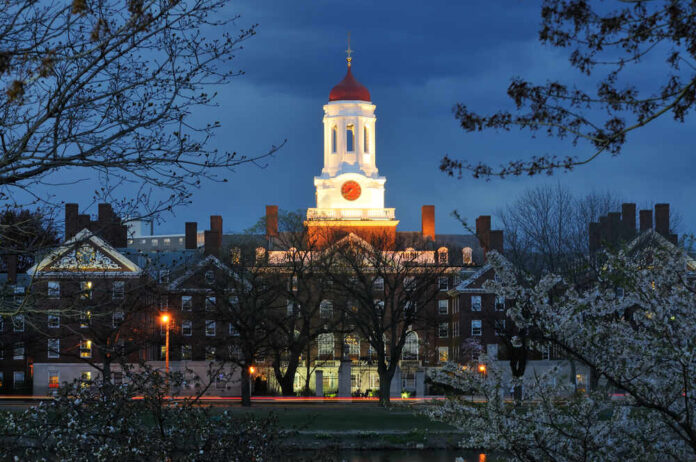 Harvard,University,At,Night.,Dunster,House,Clock,Tower,And,Red