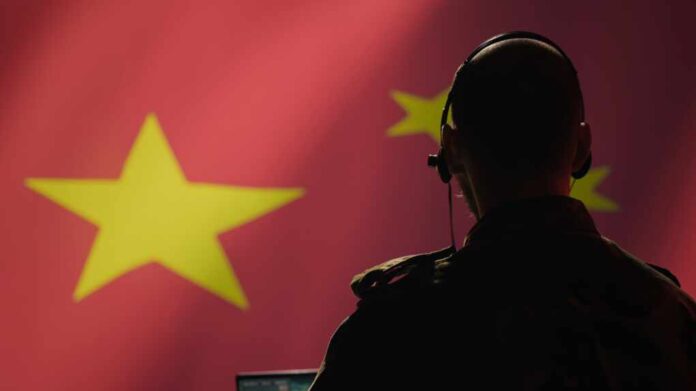 Chinese,Army,Military,Dispatcher,Looking,At,Surveillance,Transmission,On,Laptop,
