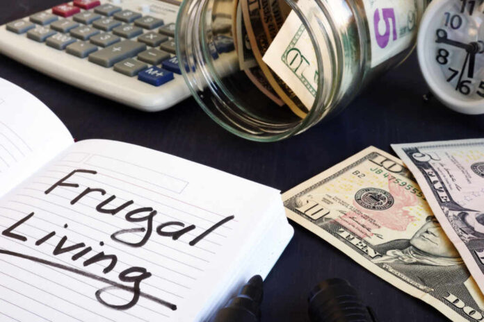 Frugal,Living,Written,On,A,Note,Pad,And,Money.