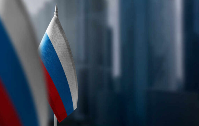 A,Small,Flag,Of,Russia,On,The,Background,Of,A