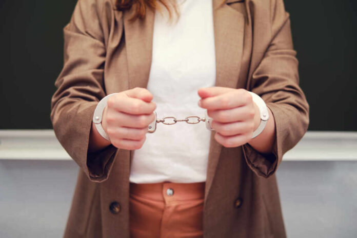 Woman,In,Handcuffs,,Concept,Of,Crime,And,Arrest,Of,Teachers