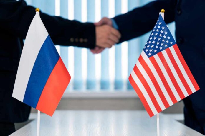 Close-up,Of,Two,Businesspeople,Shaking,Hands,In,Front,Of,Us