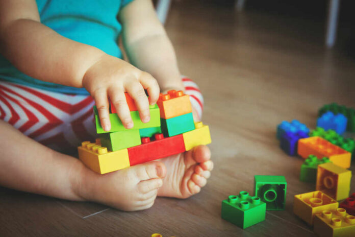 Little,Baby,Playing,With,Colorful,Plastic,Blocks