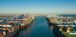 Aerial view of cargo ships docked at a shipping port