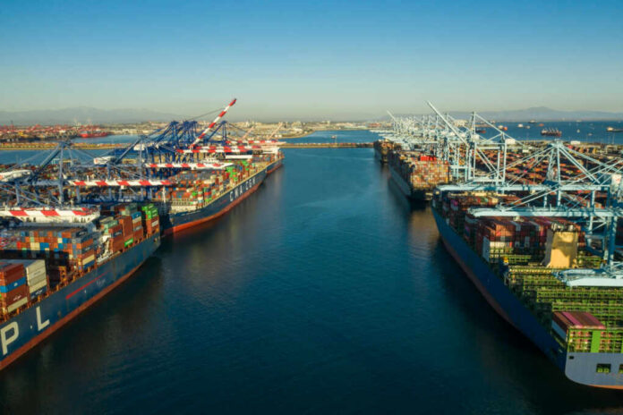 Aerial view of cargo ships docked at a shipping port