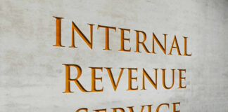 Signage of the Internal Revenue Service on a concrete wall