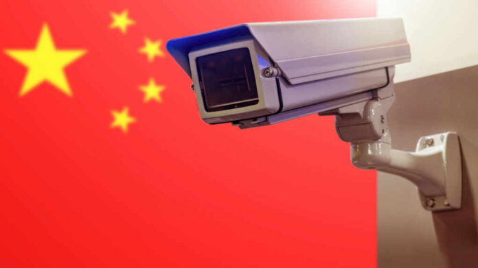 Surveillance camera in front of the Chinese flag