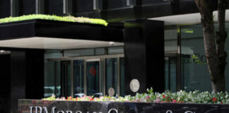 Exterior view of JP Morgan Chase & Co. building with landscaped entrance