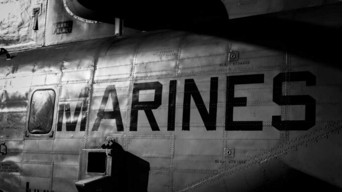 Close-up of a military helicopter with MARINES written on the side