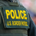 Close-up of a police officers uniform with U.S. Border Patrol insignia