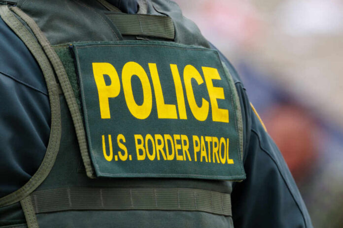 Close-up of a police officers uniform with U.S. Border Patrol insignia