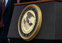 Close-up of the Department of Justice seal on a podium