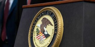 Close-up of the Department of Justice seal on a podium