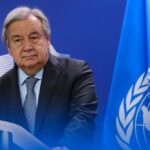 UN Secretary-General standing at a podium during a press conference