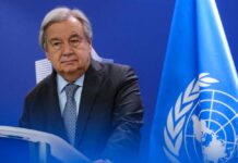 UN Secretary-General standing at a podium during a press conference