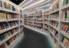 Interior view of a modern library with bookshelves filled with colorful books