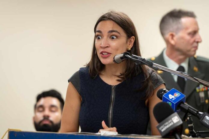 A woman speaking passionately at a podium with microphones