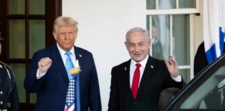 Two political leaders standing outside the White House, one raising a fist and the other waving