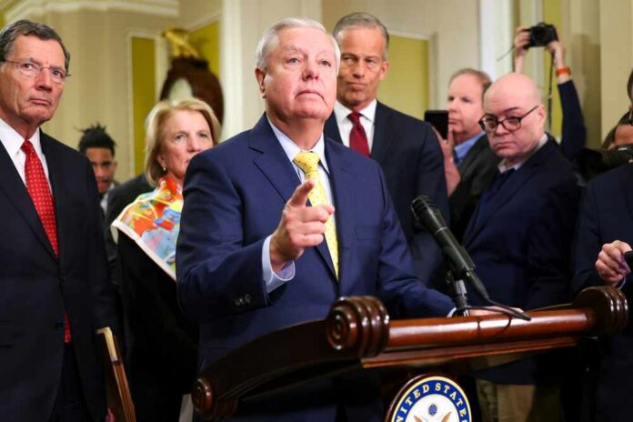 shutterstock_2585386113.jpg A group of government officials at a press conference with one speaking into a microphone