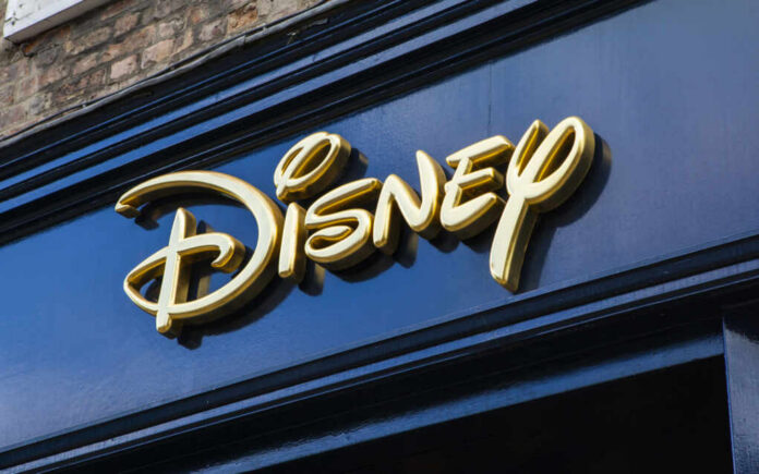 Golden Disney logo on a dark blue storefront