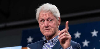 Former president gesturing while speaking at an event