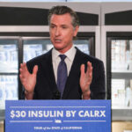California governor speaking at a press conference about insulin pricing