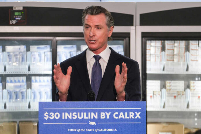 California governor speaking at a press conference about insulin pricing