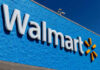 Walmart store sign against a bright blue wall