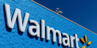 Walmart store sign against a bright blue wall