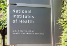 Vaccine Mandate Rebel Appointed NIH Director Sign for the National Institutes of Health displaying its affiliation with the U.S. Department of Health and Human Services