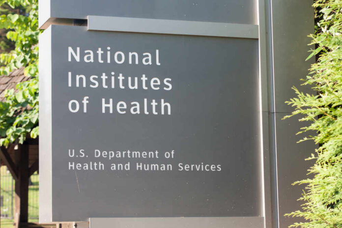 shutterstock_1168340341.jpg Sign for the National Institutes of Health displaying its affiliation with the U.S. Department of Health and Human Services