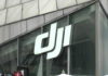 Close-up of the DJI logo on a glass building