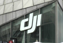 Close-up of the DJI logo on a glass building