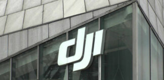 Close-up of the DJI logo on a glass building