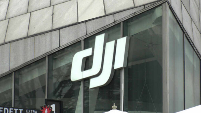 Close-up of the DJI logo on a glass building