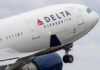 Close-up of a Delta Airlines airplane during takeoff