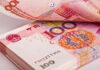 BRACE: Iran’s Tollbooth Scheme – Global Oil Chaos Close-up of Chinese banknotes stacked together