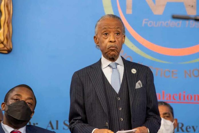 A speaker at a press conference addressing an audience