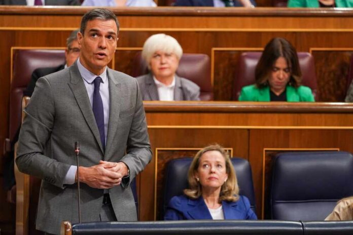 A politician delivering a speech in a government assembly with attentive audience members