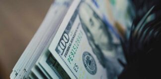 Wealth Tax Debacle: Minnesota’s Risky Experiment Close-up of a stack of hundred dollar bills