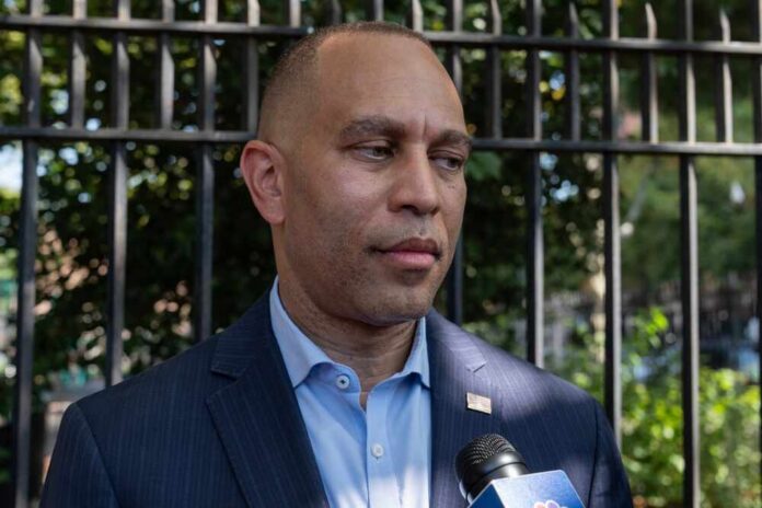 A political figure speaking to the media outdoors