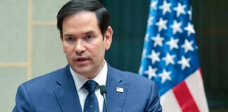 Rubio Warns – NATO’s Future in Jeopardy Marco Rubio speaking at a podium with an American flag in the background