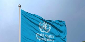 WHO’s Bold Move: Global Health Overhaul Flag of the World Health Organization waving against a blue sky