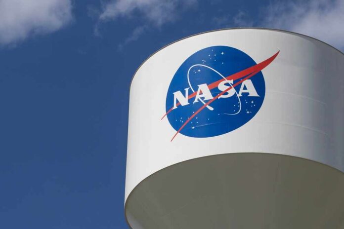 NASA logo on a water tower against a blue sky