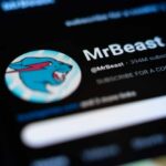 Close-up of MrBeast's YouTube profile on a smartphone screen