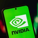 NVIDIA Powers AI With PLUTONIUM — What’s Happening? NVIDIA logo displayed on a smartphone screen with a green background